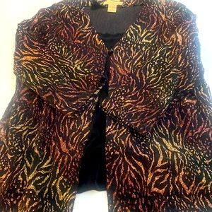 Glittery sweater with black under shell. One piece.